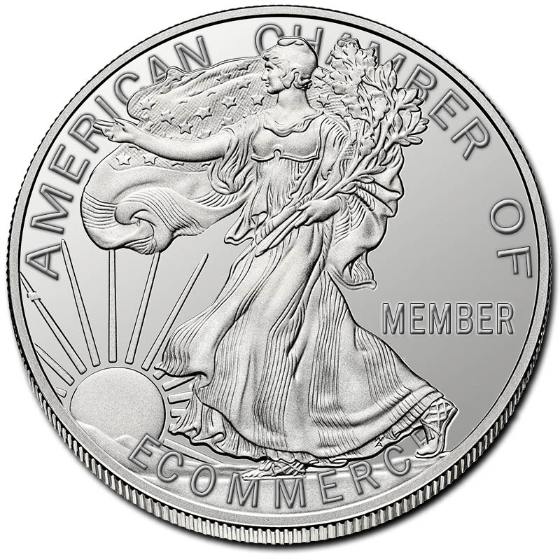a beautiful silver dollar with lady liberty in a flowing dress, modified with the chamber's name